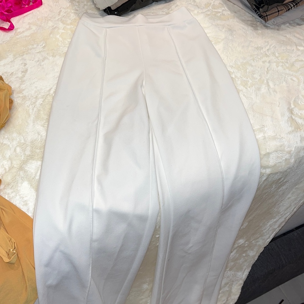 fashion nova Small white bell bottom pants sheer, stretchable but also fitting